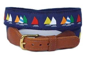 Men's nautical sailboat ribbon belt comes in multi colored sails on a navy ground